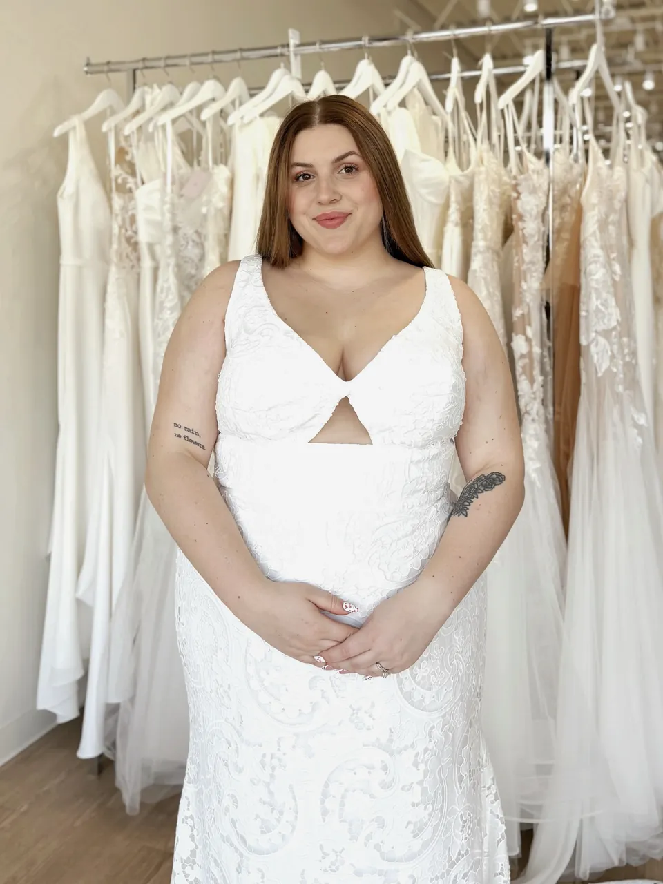 V-neck lace fit-and-flare wedding dress with a keyhole cutout at the waist