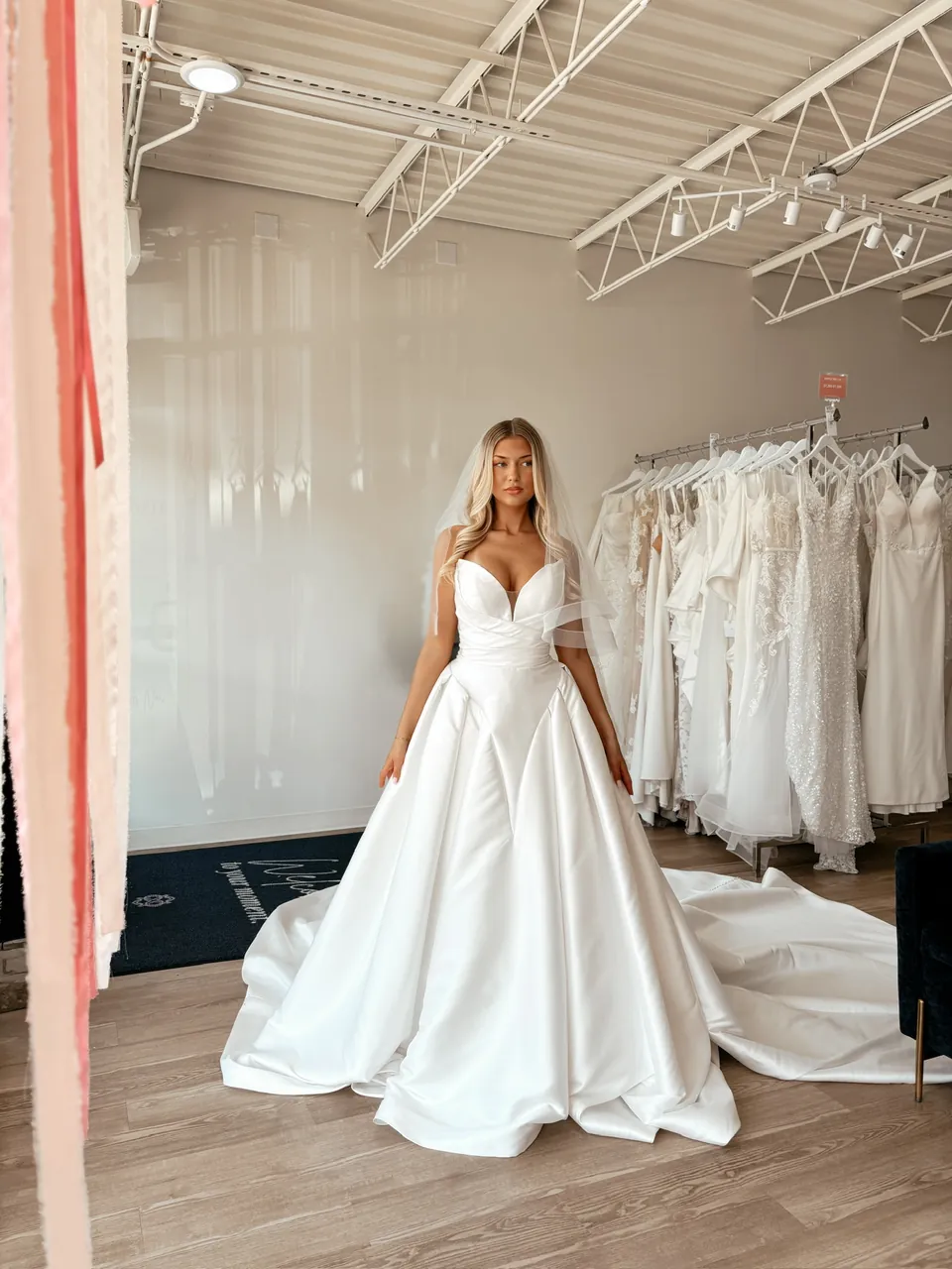 V-neck satin ballgown with thin straps and a full skirt