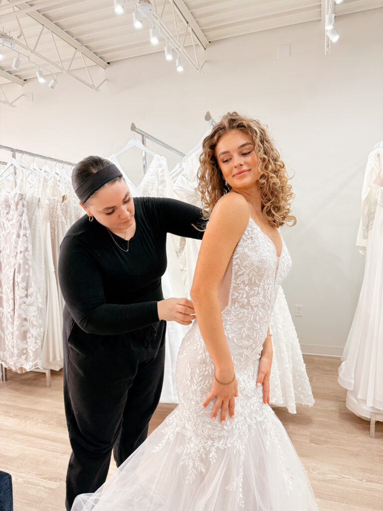 stylist assisting bride