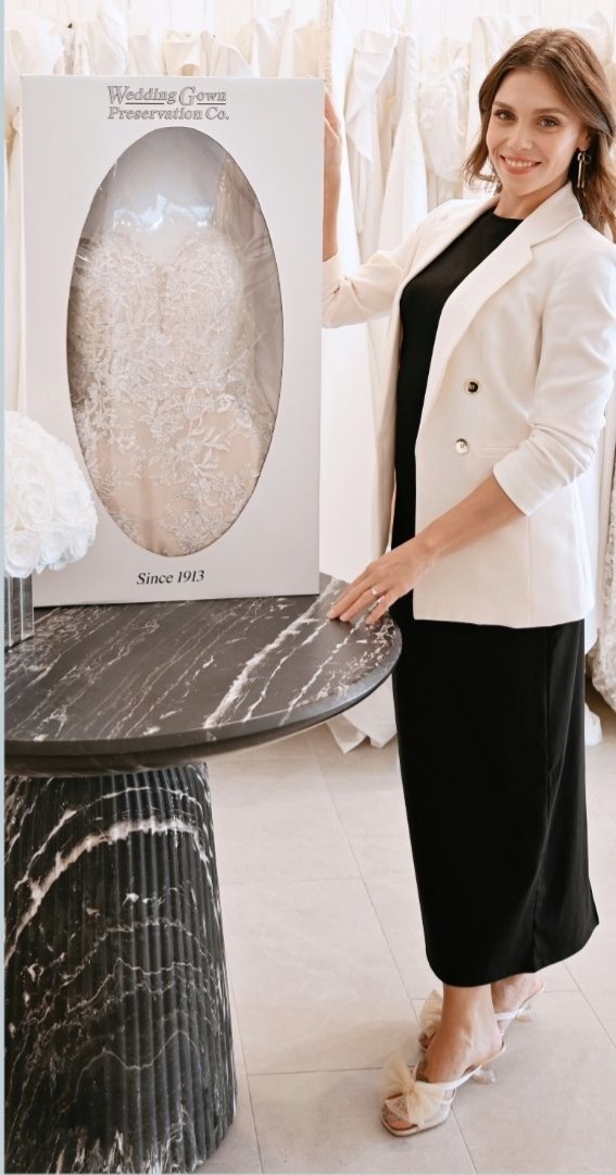 Stylist holding the dress preservation box