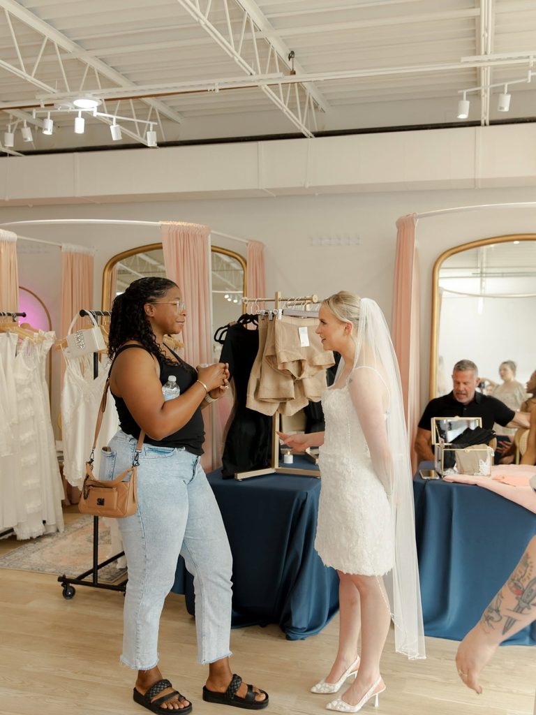 Guests enjoying a conversation inside Vow Ready during the grand opening celebration.